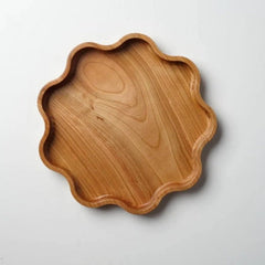 Single star shaped wooden serving tray with scalloped edge, top view