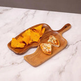 Wooden snack platter with handle holding nachos and mini pizzas on marble