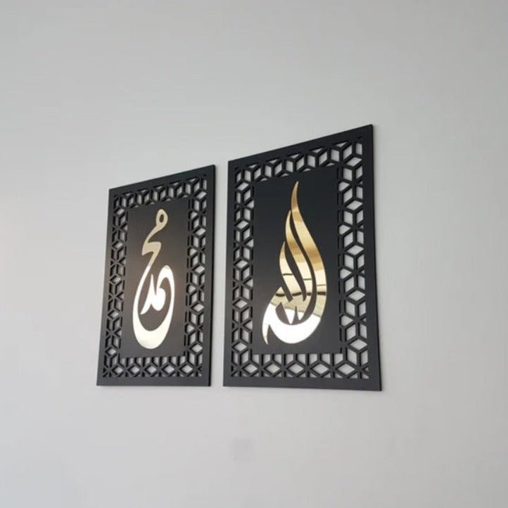 Pair of black calligraphy frames with gold lettering on grey wall, side angle