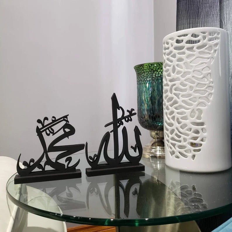Black Allah Muhammad calligraphy decor on glass side table with white vase