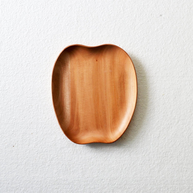Empty apple shaped wooden serving tray on white surface, top view