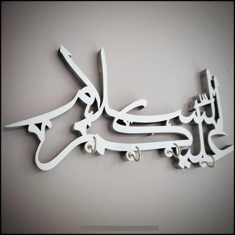 White Assalamualaikum Arabic calligraphy key holder without keys, front view