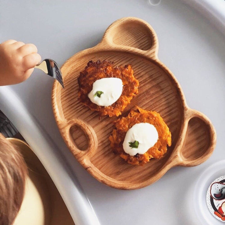 Bear shape wooden platter tray with pancakes, child eating with fork