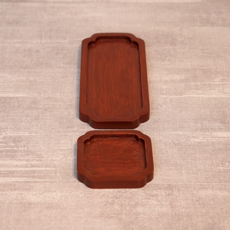Top view of long and square dark brown wooden tea trays