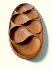 Teak wood oval serving tray with teardrop compartments standing upright