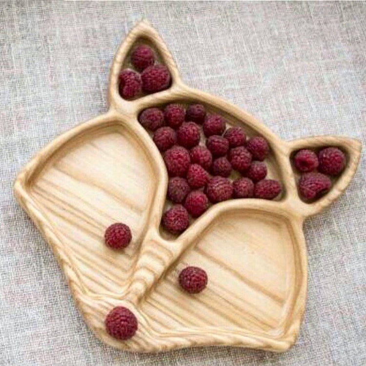 Light wood fox shaped divided platter with red berries in sections