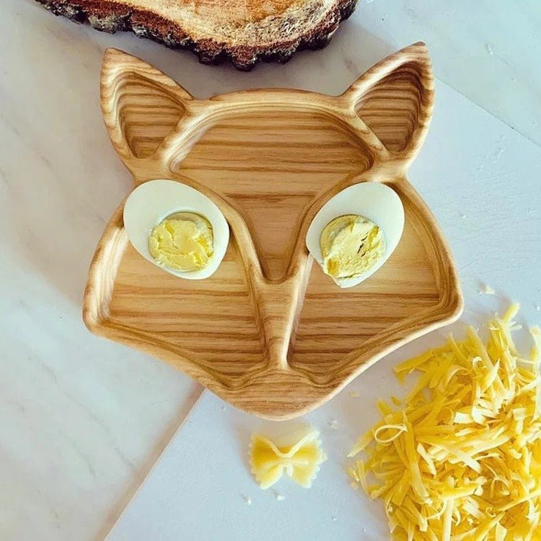 Fox shaped wooden tray with boiled eggs as eyes and pasta