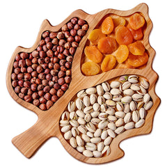 Top view of maple leaf solid wood snack tray with three filled compartments