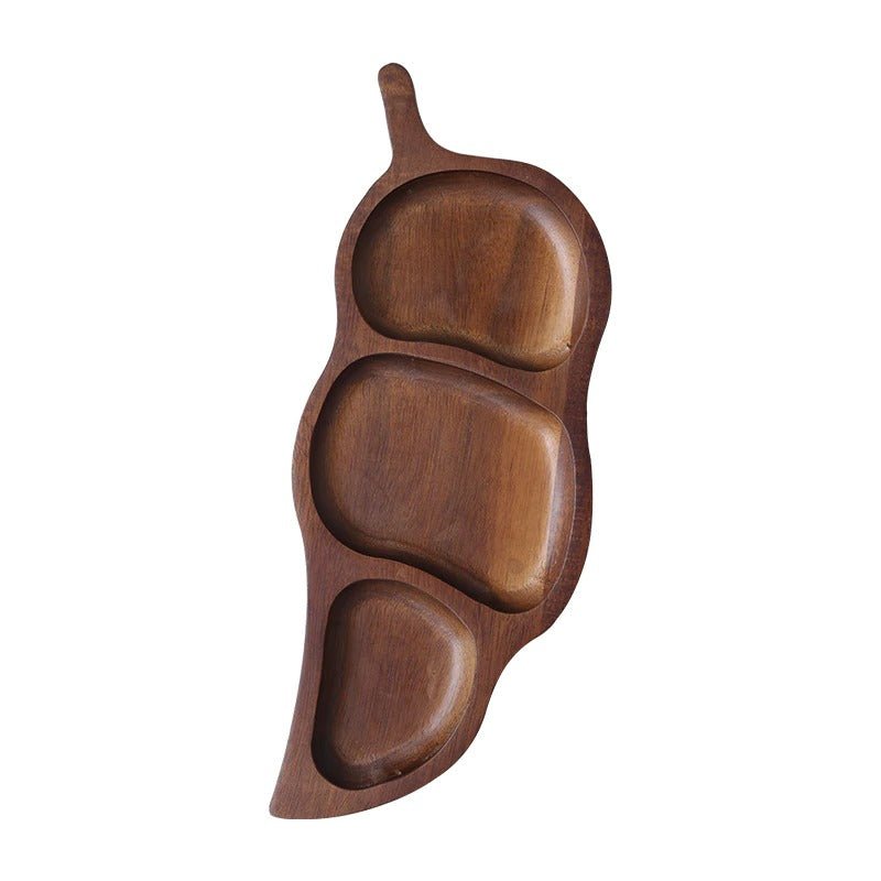 Empty dark walnut leaf shaped dry fruit tray with three compartments, top view