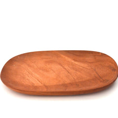 Empty oval shape wooden serving platter, angled view on white background
