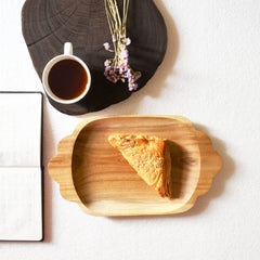 Scallop rectangle wooden platter with slice of pie beside coffee cup