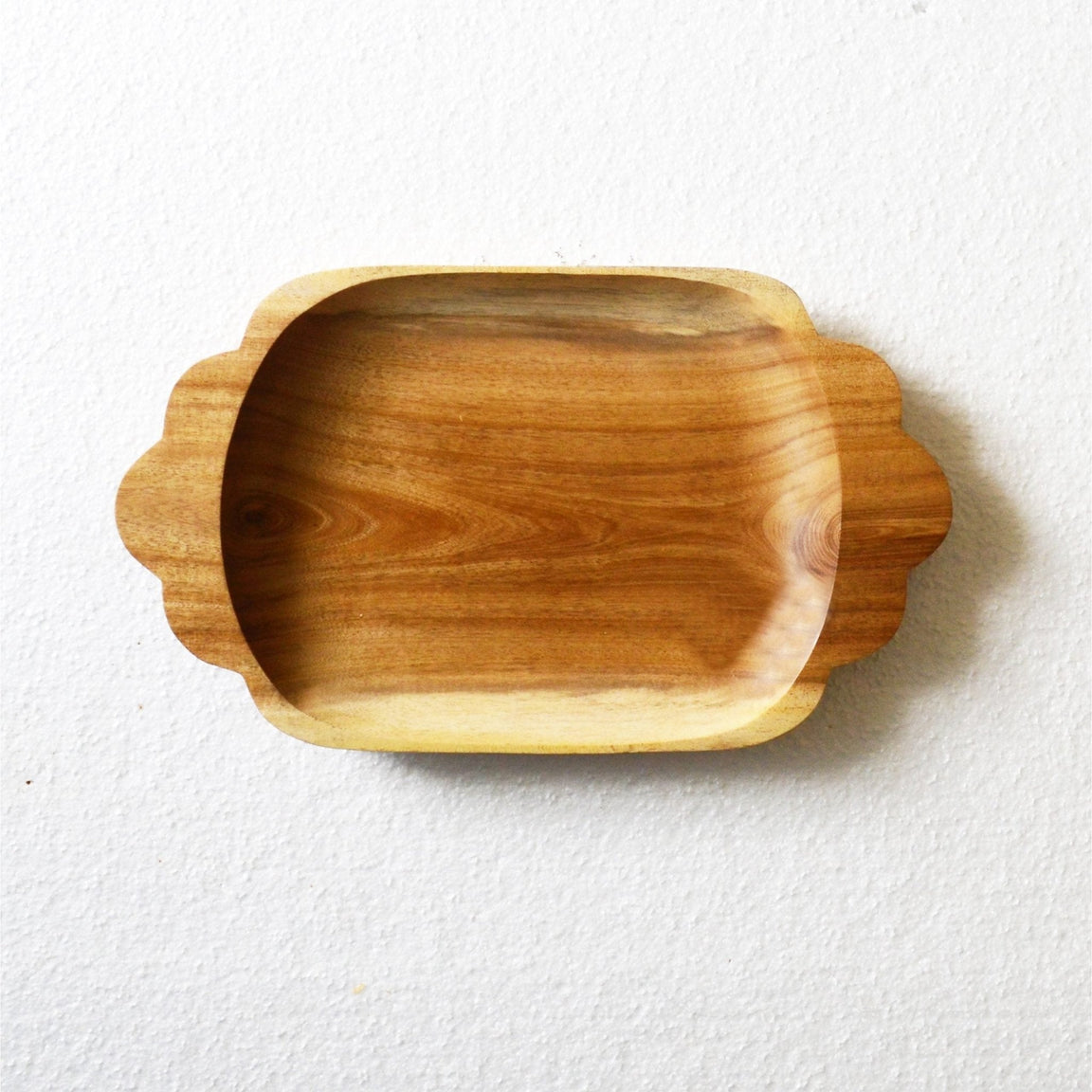 Empty rectangle wooden platter tray with scalloped handles, top view