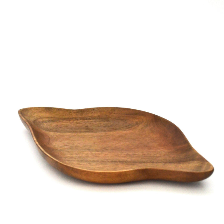 Side angle of shell shape wooden platter tray on white background