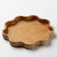 Star shaped solid wood kitchen tray platter, low angle side view