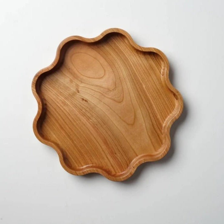 Single star shaped wooden serving tray with scalloped edge, top view