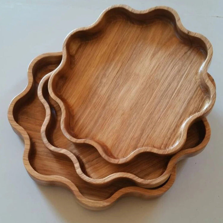 Three star shaped solid wood serving trays stacked in different sizes