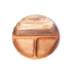 Top view of round wooden platter divided into three sections