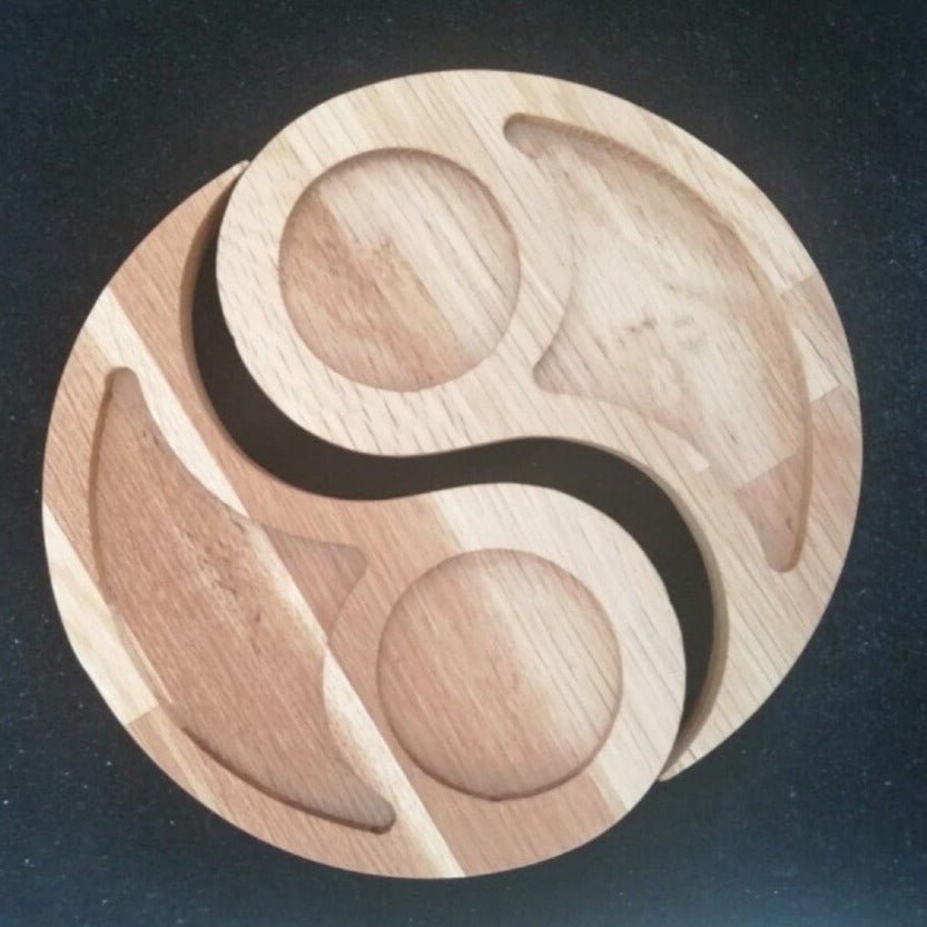 Yin yang solid wood serving tray platter in two tones on dark background
